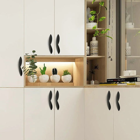 Arcuate Pulls S Shaped Cabinet Handles 5 Inch Center Matte Black Solid Zinc Alloy 4 Pack mounted on white cabinets