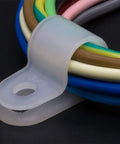 White Nylon R Type Cable Clamps One Quarter Inch 200 Piece Cable Organizer Kit capturing various cables in use.
