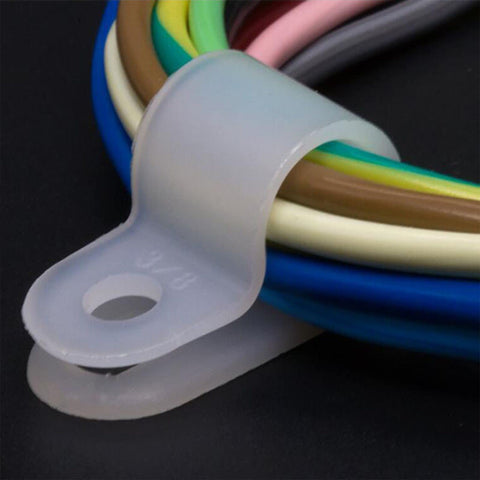 White Nylon R Type Cable Clamps One Quarter Inch 200 Piece Cable Organizer Kit capturing various cables in use.
