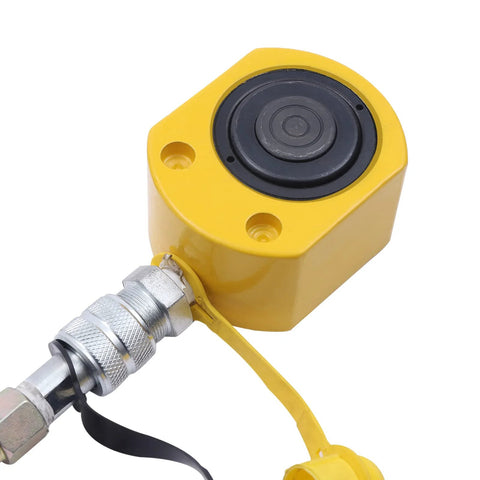 Close-up of yellow hydraulic cylinder jack head with black circular top and metal hose fitting.