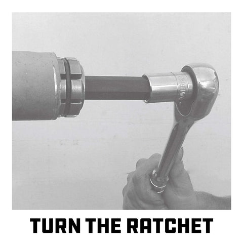 Powerbuilt tailpipe expander side view with ratchet handle; alloy steel construction for 1-1/8"–1-3/4" exhaust pipes.