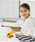 Girl playing with toy from 4 Pack Adorable Construction Truck Set with Realistic Front End Loader Models for imaginative play