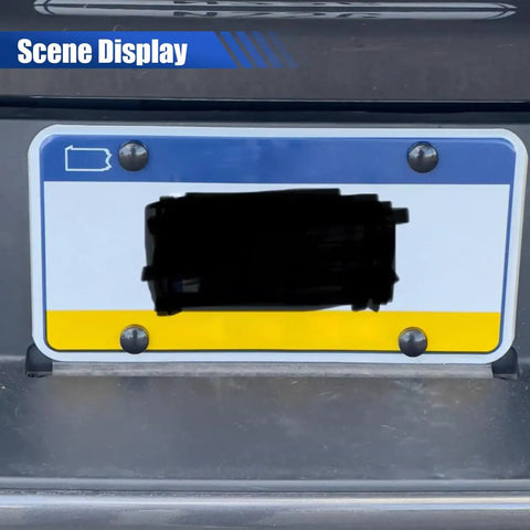 Tough As Nails Stainless Steel License Plate Screw Kit with heavy duty black screws securing a license plate on a vehicle.