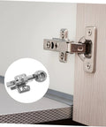 Installed stainless steel cabinet hinge with hydraulic buffer on wood kitchen door; inset shows close-up view