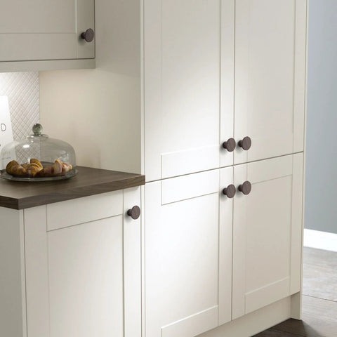 Kitchen cabinets with Wooden Cabinet Door Handles Four Pack Minimalist Single Hole Drawer Pulls For Wardrobes on white doors.