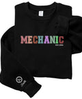 Personalized Mechanic Embroidered Sweatshirt Featuring Custom Name On Sleeve With Top Shelf Quality Crew Cab Work Gear As A Badass Gift For Grease Monkeys With Soft Brushed Interior. Black crew sweatshirt with colorful "MECHANIC" embroidery.