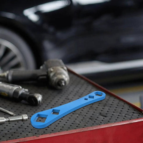 Heavy Duty Oil Drain Screw Removal Tool And 30mm Hexagonal Socket Wrench For Cars on a tool table with other equipment.