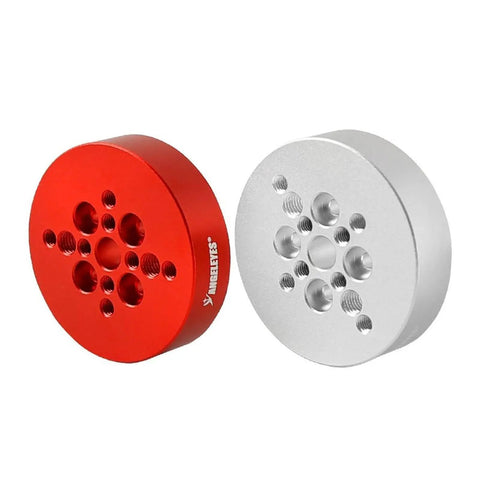 Red and silver circular dovetail plate adapter for telescope and camera mounts, sturdy metal for astrophotography setup.