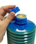 Hand opening 700ml LHL X100 7 CNC Machining Center Heavy Duty Grease container, blue cap detached, yellow lubricant visible