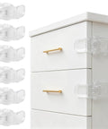 Six Pack Clear Baby Drawer Locks Zero Sweat Install Keep Little Rascals And Fur Babies Locked Out installed on white dresser.