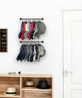 Set Of 2 Black Wall Mounted Hat Racks With 20 Hooks For Caps Visors And Snapbacks installed in entryway.