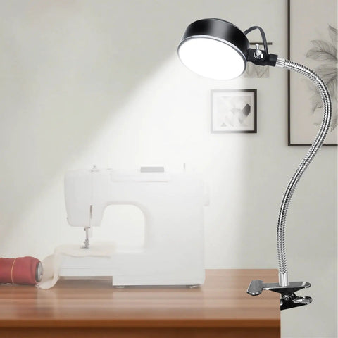 Beast Mode Clamp Light with Flexible Clip, focusing on sewing table, showcasing 20W, 2000 lm LED for craft bench lighting, ideal for workshops.