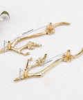 Two Slick Twig Drawer Pulls In Polished Brass Plum Blossom Branch Handle For Cabinets And Dressers on white surface