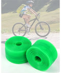 Bike Tire Liner Set for Mountain Bikes 2 Liners Puncture Protection in green material with cyclist in background