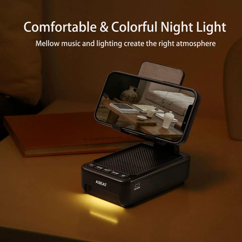 Phone Stand With Bluetooth Speaker And LED Color Changing Light on desk with phone, glowing LED light, and textured surface