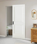 Kick Back Those Old Hinges With This Seamless Concealed Sliding Barn Door 30 By 84 Inches, white door in minimalist room setting.