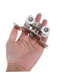 2 Pack Stainless Steel Sliding Door Pulleys With Silent Nylon Rollers, shown held in hand, highlighting size and material