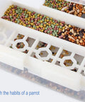 Two Piece No Mess Automatic Bird Feeder For Pet Cages No Sweat Seed Dispenser with colorful seed assortment visible.