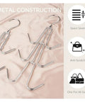 Two silver metal closet purse hangers arranged on a soft surface, part of 2 Pack Closet Purse Hangers, Game Changer Handbag Organizer Rack.