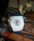 Person using Top Closing Bolt Bag With 3 Inch Drawstring, Load Rated Tool Bag For 5 X 10 X 9 Inches, Built Tough No 4 Canvas