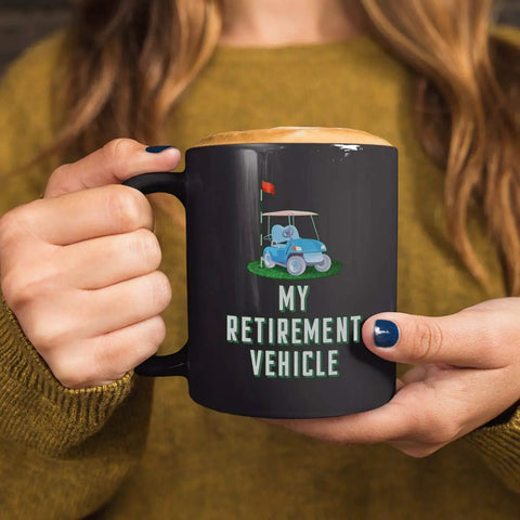 Sweet Retirement Ride Golf Cart Coffee Mug In 15 Oz Black Ceramic With Hella Durable Glaze For Retired Golfers And Youth Coaches Looking To Kick Back With Their Daily Brew held by a person