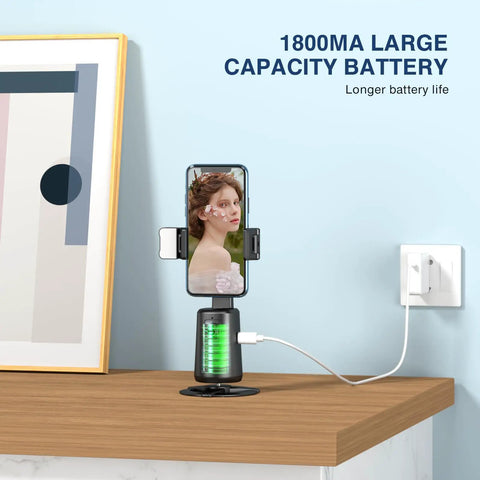 Face Tracking Tripod With 360 Degree Real Time Rotation For Smartphones No App Needed Remote Control Black on desk
