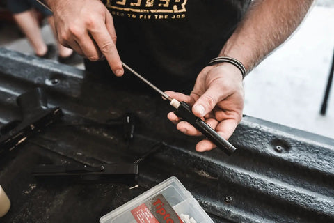 Person using Felt Cleaning Pellets for 22 Caliber With Jag, Durable Caliber Specific Gun Cleaning Pellets for rifle barrel cleaning