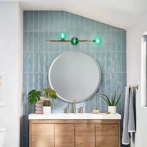 Dope Gold Long Strip 3 Light Globe Vanity Wall Sconce With Green Glass Shades Minimalist Mirror Bathroom Lighting Modern Contemporary Wall Fixture For Vanity And Mirror Area above round mirror and vanity sink.
