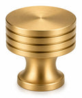 Slick Brushed Gold Cabinet Knobs Two Pack Modern Three Groove Handle Style showcases a stylish 1.2-inch brushed gold knob.