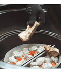 Adding wood to charcoal grill with Heavy Duty Plated Steel Grill Tool Holder Hooks for 18.5 Inch and 22.5 Inch Charcoal Grills.