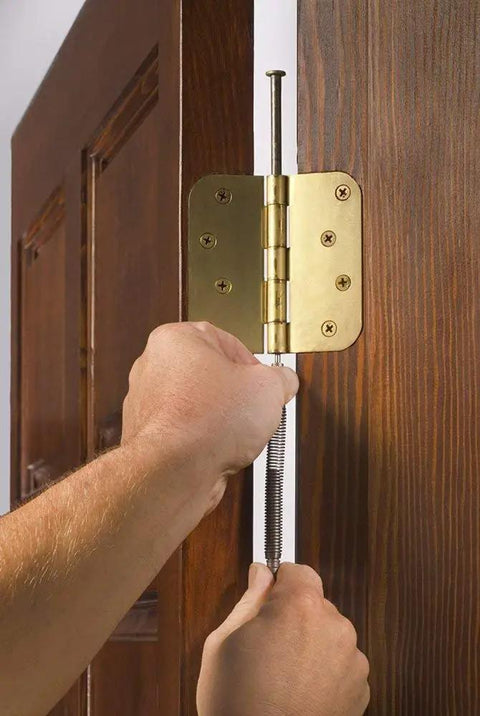 Pro Door Hinge Pin Remover And Nail Set Tool 2 In 1 Hammerless Pin Removal used on a door hinge, showing spring-powered mechanism.