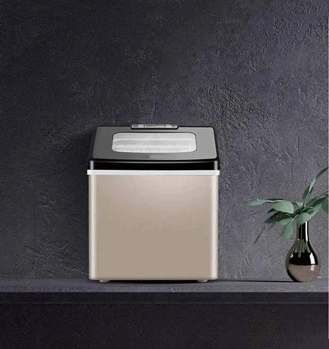 Top Shelf Portable Countertop Ice Maker Machine Snaps Frosty Cubes In Minutes Transparent Viewing Window Food Safe Abs Body smooth design on kitchen shelf.