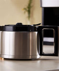 Fully Automatic Home Coffee Maker With Integrated Grinder And Guided Assisted Tamping Crafted For Smooth Third Wave Espresso And Real Barista Quality Shots Daily Zero Hassle Guaranteed, stainless steel coffee pot with black lid.