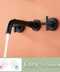 Matte Black Wall Mount Bathroom Faucet With Two-Handle Design, Honeycomb Spout For Less Splash shown against orange wall
