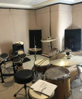 Ditch Junky Foam For This Top Shelf Sound Absorption Sheet Black Sound Dampening Blanket used in music room with drums.