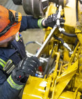 Worker using Winter Ready Insulated Work Gloves with Impact Protection while handling machinery, showing heavy duty grip