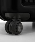 Close-up of a durable spinner luggage wheel, showcasing smooth mobility features.