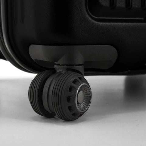 Close-up of a durable spinner luggage wheel, showcasing smooth mobility features.