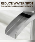 Close-up of Brushed Nickel Tall Vessel Sink Faucet With Single Hole And Single Handle Waterfall Style spout detail