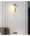 Sleek Indoor Led Wall Lamp With Solid Aluminum Body And Modern Nordic Design installed on a white wall with pull chain.