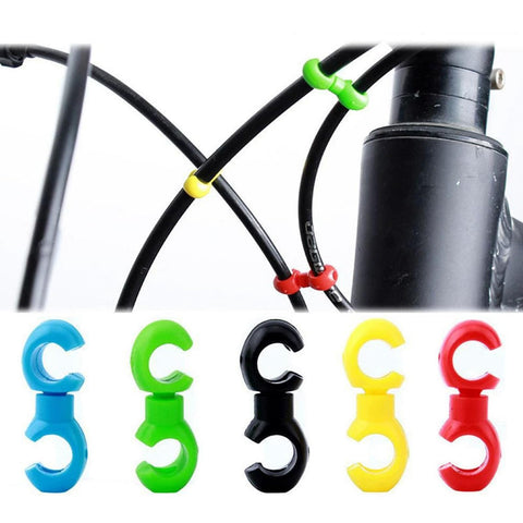 Multipurpose Alloy Bicycle Brake Line Clamps And Cable Clips For Road Bikes in multiple colors and installed on bike cables.