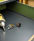 Heavy Duty Plasma Cutting Guard S45 Black Plastic Retaining Cap Fits Most Welding Nozzles And Consumables For Industrial Use With Versatile Application And Efficient Space Utilization Design on a workbench next to tools.
