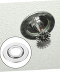 Straight Up Sharp Set 5 Pack Decorative Fire Sprinkler Cover Plates with a stainless steel finish installed on a ceiling.