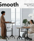 Two women using Height Adjustable Rolling Standing Desk On Wheels 28 To 46 Inches 31.5 By 15.75 Inches Sit Stand Computer Workstation