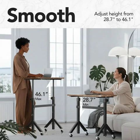 Two women using Height Adjustable Rolling Standing Desk On Wheels 28 To 46 Inches 31.5 By 15.75 Inches Sit Stand Computer Workstation