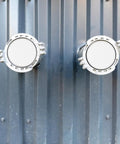 Rock Solid Iron Fire Sprinkler Cover Plate Concealer That Hides Those Bulky Heads - two white cover plates mounted on a wall.