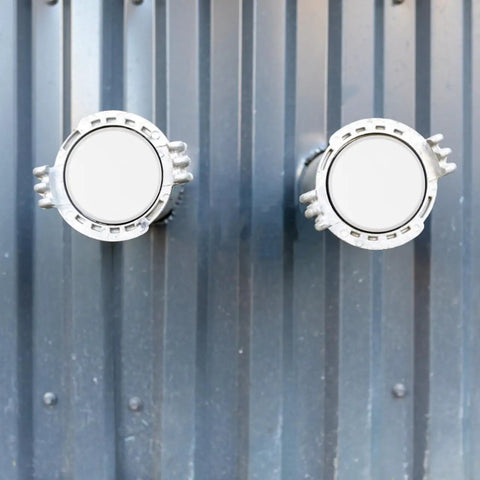 Rock Solid Iron Fire Sprinkler Cover Plate Concealer That Hides Those Bulky Heads - two white cover plates mounted on a wall.