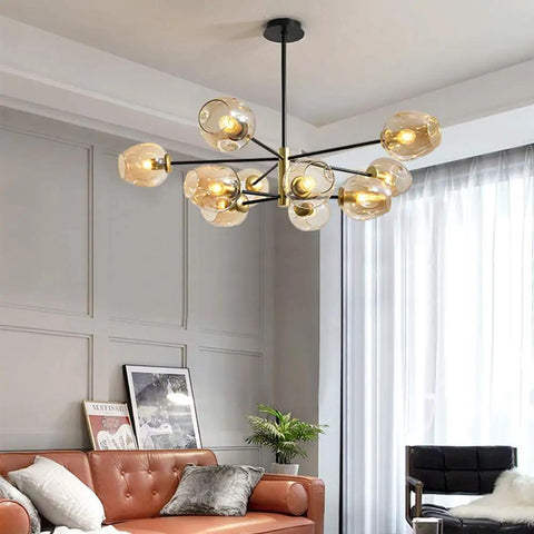 5-Light Sputnik Chandelier With Airblown Glass Globes In Sleek Smoke Grey in modern living room above sofa.