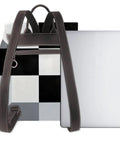 Kick Up Your Daily Fit With This Slick Black And White Piano Grid Womens Leather Backpack Featuring Waterproof Build And Hella Spacious Storage For Travel Or Work, showcasing the bag's zip compartment and laptop slot.