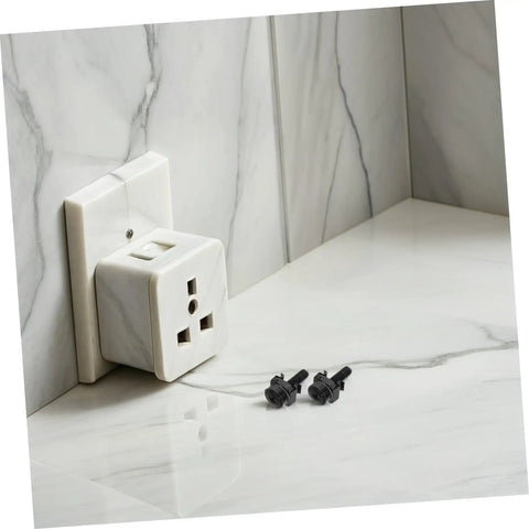 50 Piece M5X25 Metal Server Rack Screw And Cage Nut Kit Delivers RockSolid Grip With Zero Hassle Install For Network Racks And Cabinet Panels Allowing You To Mount Any Equipment Fast While Keeping Your Gear Tidy And Organized No Drama, black screws beside a white wall-mounted outlet.